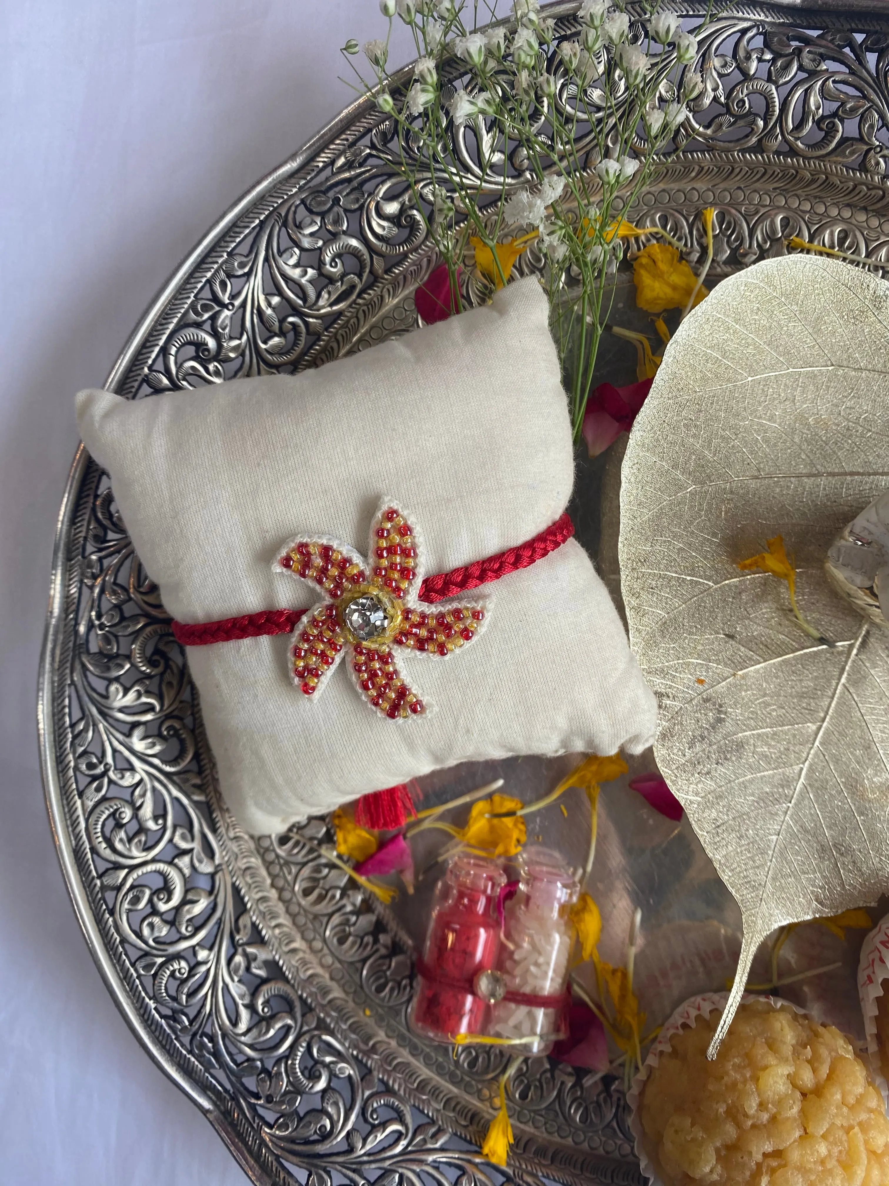 Coral Whirl  Embroidered Rakhi