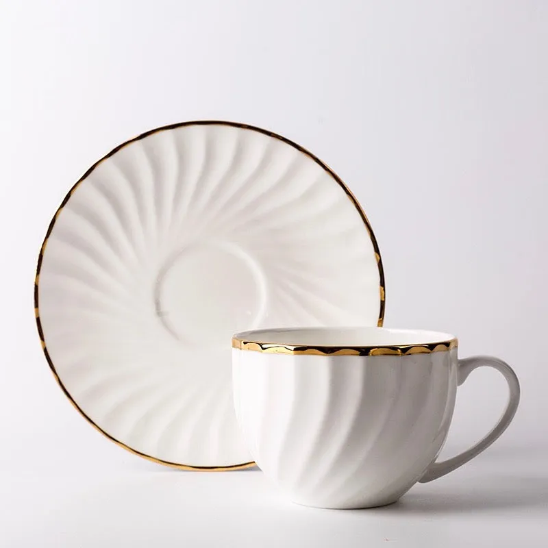 Elegant White Tea Cup and Saucer with Gold Detail