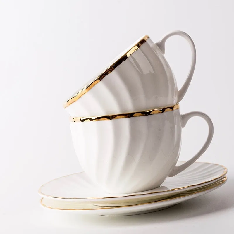 Elegant White Tea Cup and Saucer with Gold Detail