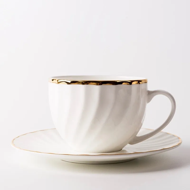 Elegant White Tea Cup and Saucer with Gold Detail