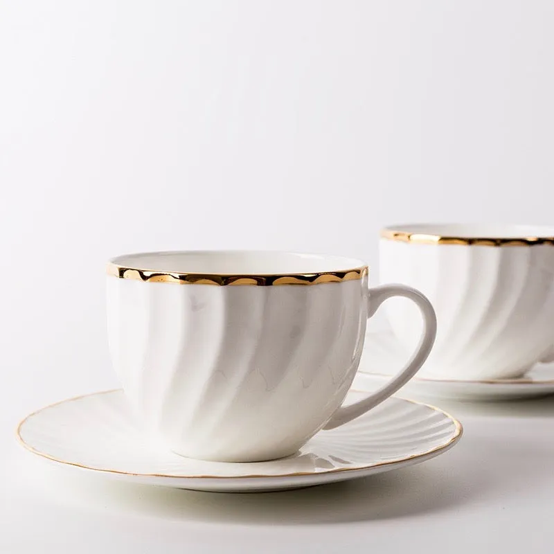 Elegant White Tea Cup and Saucer with Gold Detail